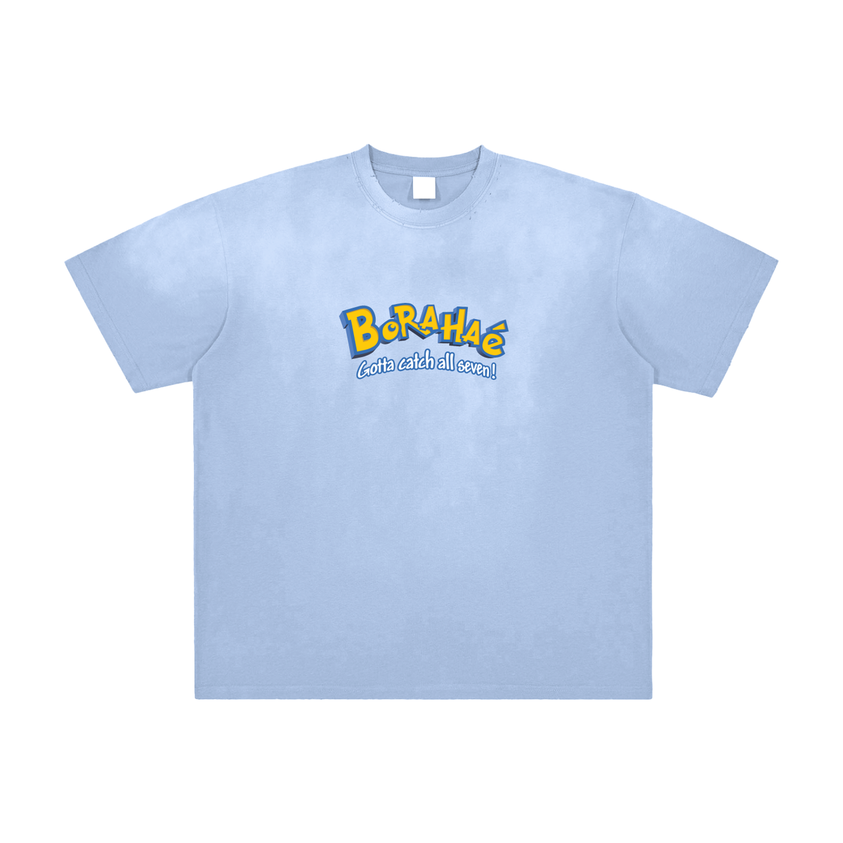A light blue short-sleeve crewneck t-shirt with a colorful graphic on the chest reading 'Borahae' in yellow and blue with the tagline 'eat with all eyes!' underneath, displayed on a clean white background.